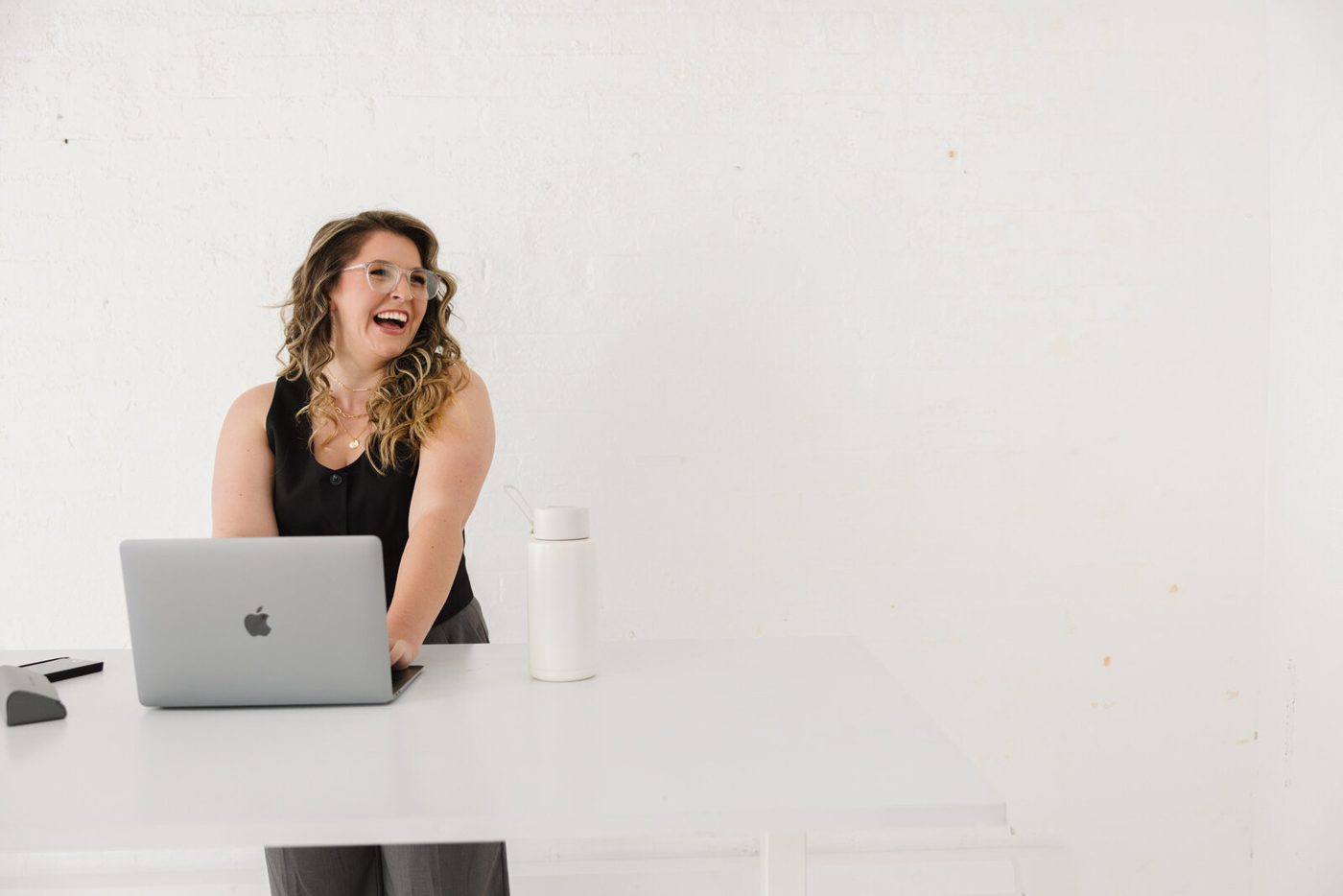 Kiah laughing at her laptop